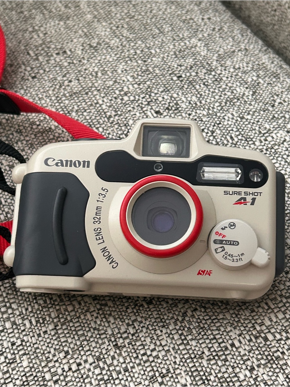 Canon Compact Film Camera in Cream and Red Accents